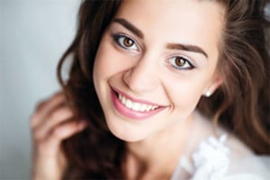 women with dark triangles removed between teeth